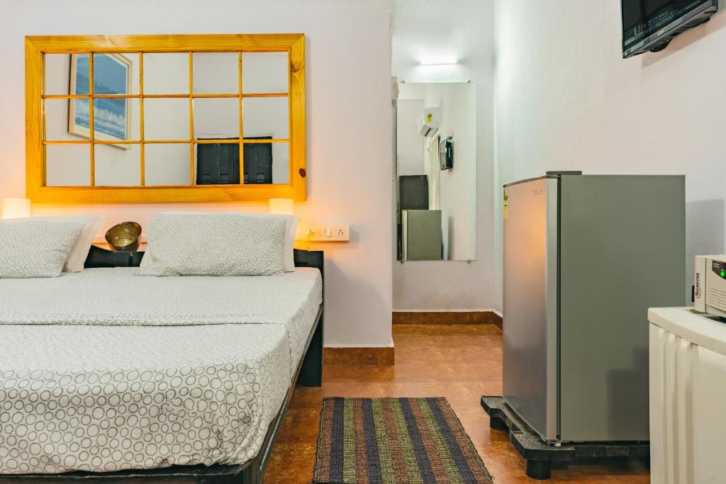 Postel nebo postele na pokoji v ubytování Rodrigues Guest House