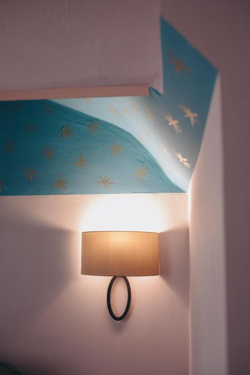 Posteľ alebo postele v izbe v ubytovaní Gregorini Bingham Art Luxury Suites