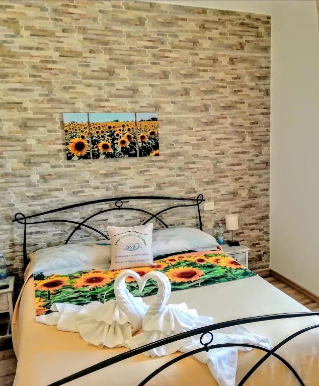 A bed or beds in a room at B&B Maremma's dream