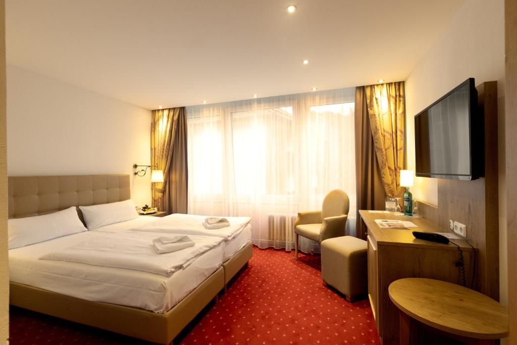 Postel nebo postele na pokoji v ubytování Vital Resort Mühl
