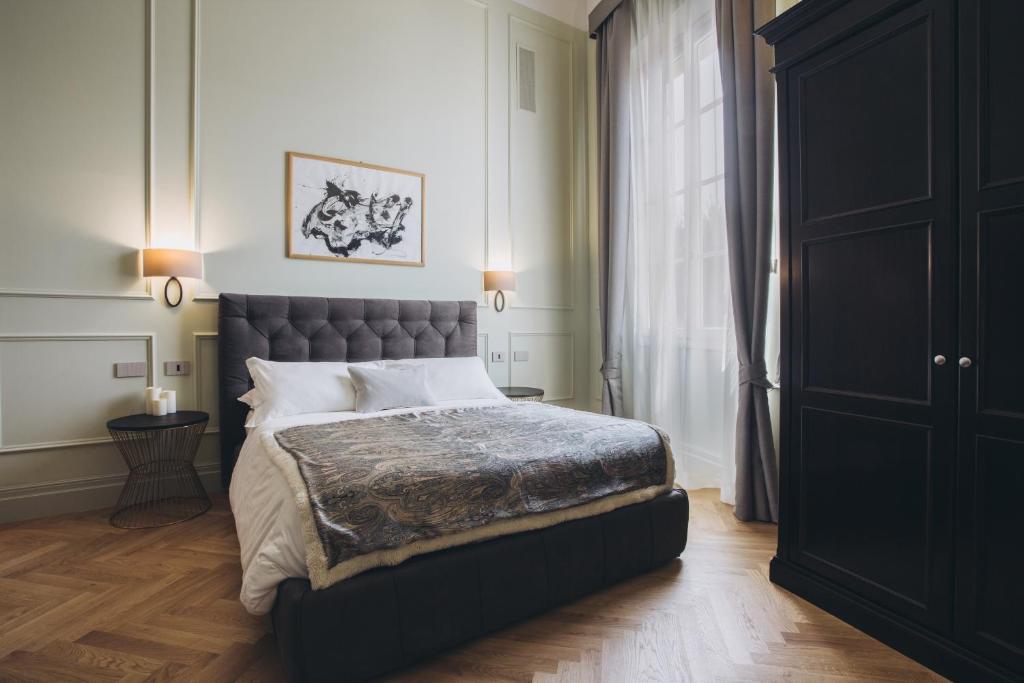 Posteľ alebo postele v izbe v ubytovaní Gregorini Bingham Art Luxury Suites