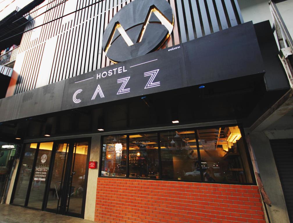 a building with a hotel carz sign on it at Cazz Hostel in Bangkok