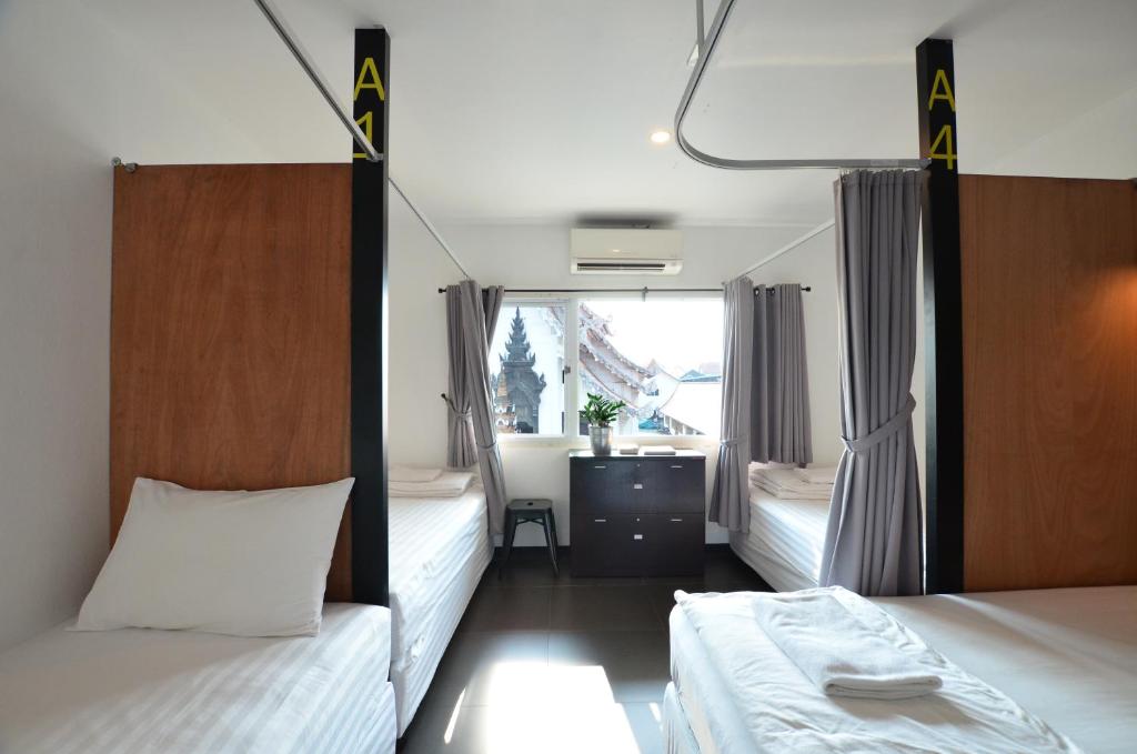 Postel nebo postele na pokoji v ubytování Fav Inn Town
