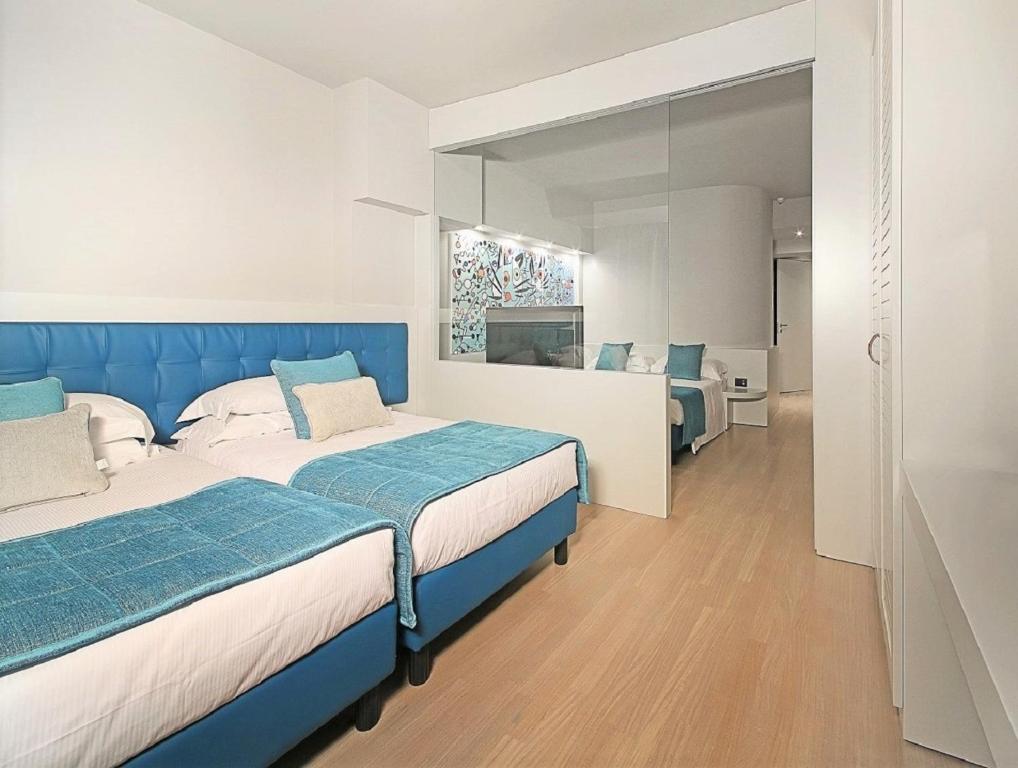 Postel nebo postele na pokoji v ubytování Hotel Salò du Parc