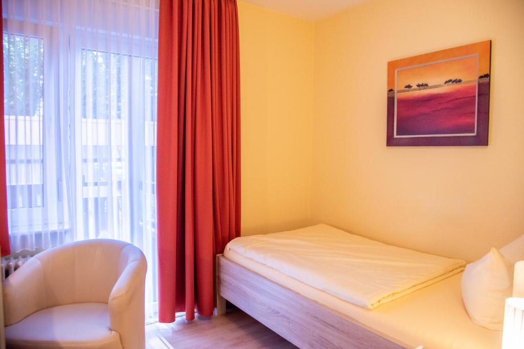 Postel nebo postele na pokoji v ubytování Hotel Nora