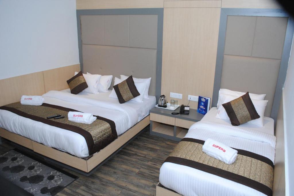 Postel nebo postele na pokoji v ubytování Hotel Superb 5 Mins Walk From New Delhi Station