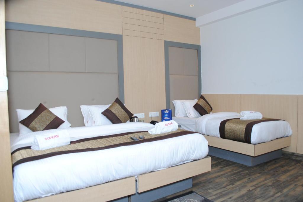 Postel nebo postele na pokoji v ubytování Hotel Superb 5 Mins Walk From New Delhi Station