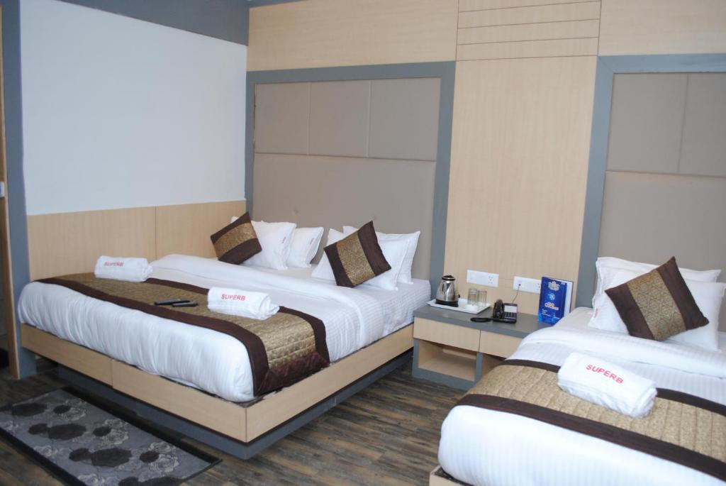 Postel nebo postele na pokoji v ubytování Hotel Superb 5 Mins Walk From New Delhi Station