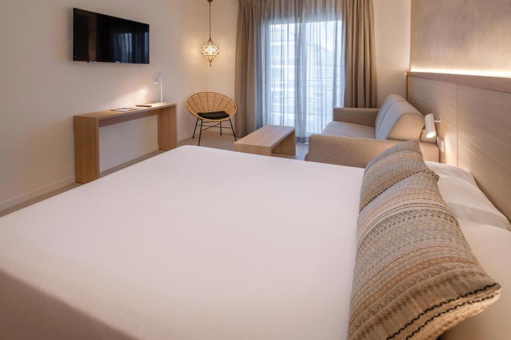 Postel nebo postele na pokoji v ubytování Hotel Alhambra