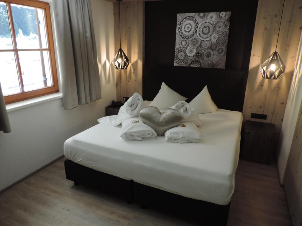 Postel nebo postele na pokoji v ubytování Hotel Möderle