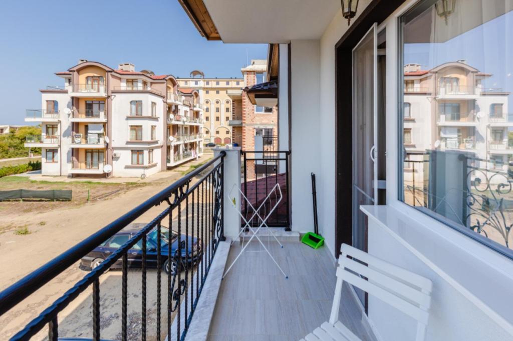 a balcony with a view of some buildings at Guest House Theona in Obzor
