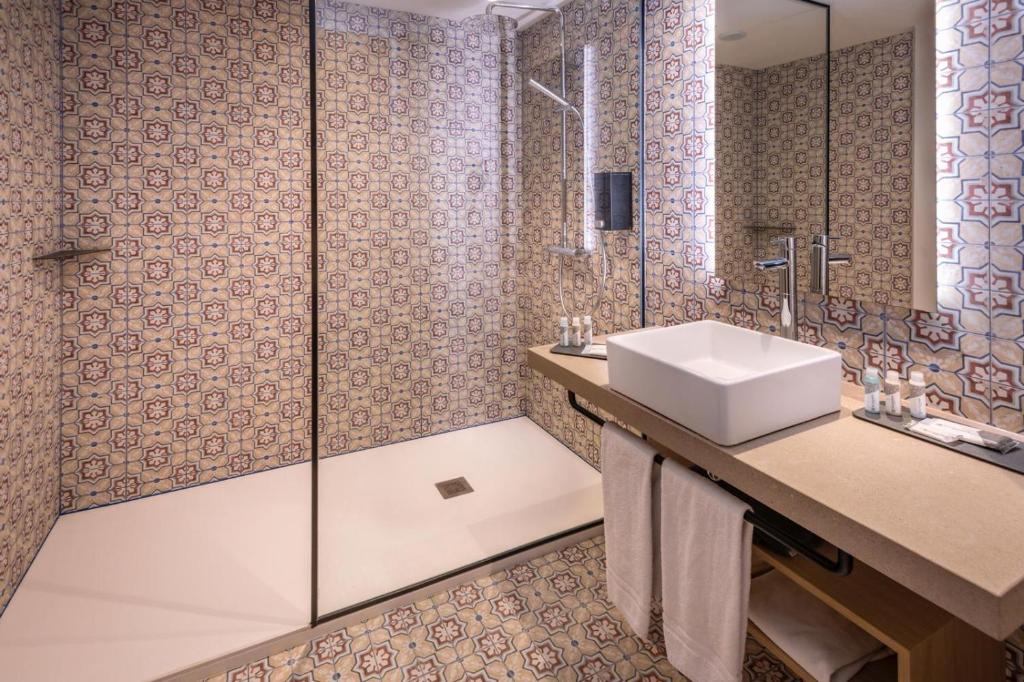 Koupelna v ubytování Hotel Alhambra