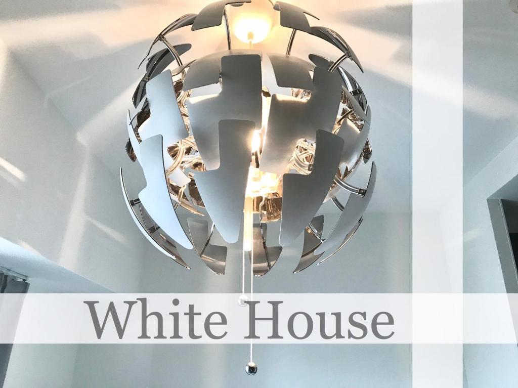 a white house chandelier in a store window at Local Hakata apartment No9 in Fukuoka