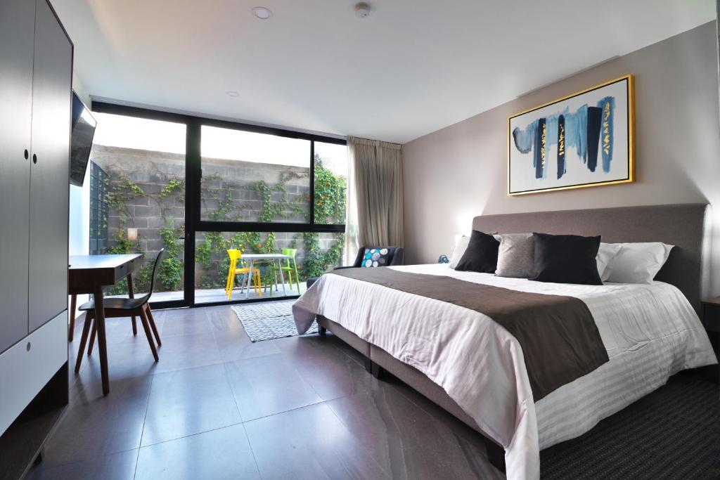 Postel nebo postele na pokoji v ubytování Arboleda 5 Luxury Lofts