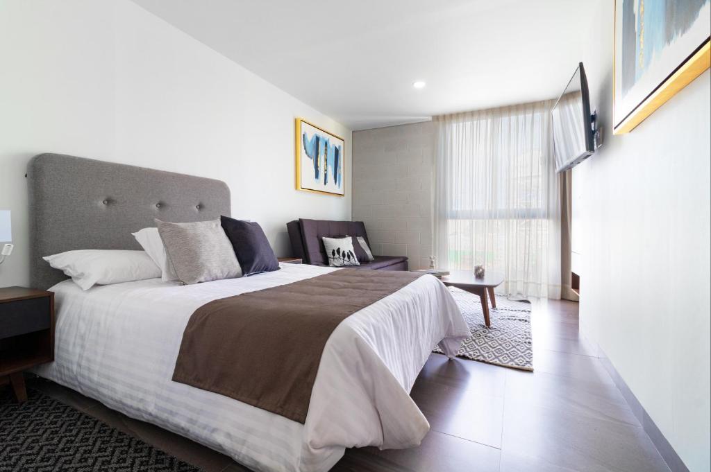 Postel nebo postele na pokoji v ubytování Arboleda 5 Luxury Lofts
