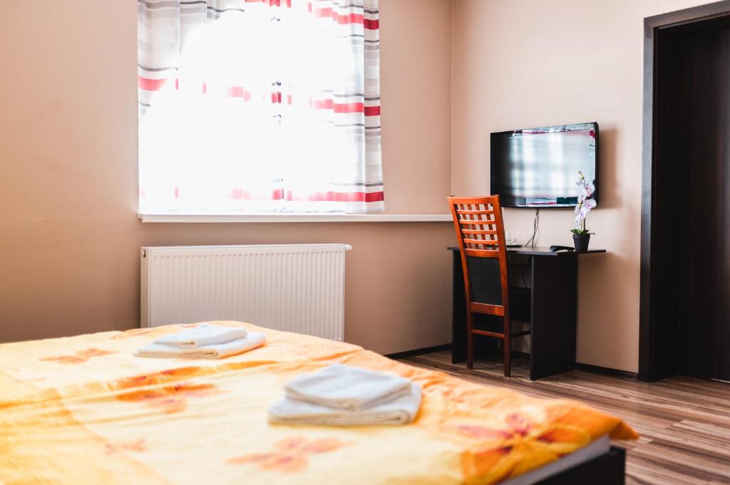 Postel nebo postele na pokoji v ubytování Motel ARD