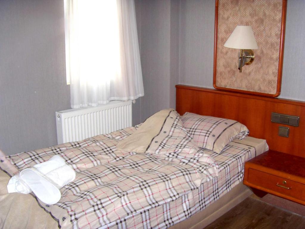Postel nebo postele na pokoji v ubytování Hotel NADIKVARI