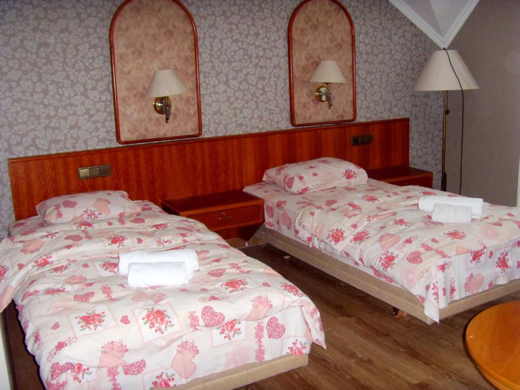 Postel nebo postele na pokoji v ubytování Hotel NADIKVARI