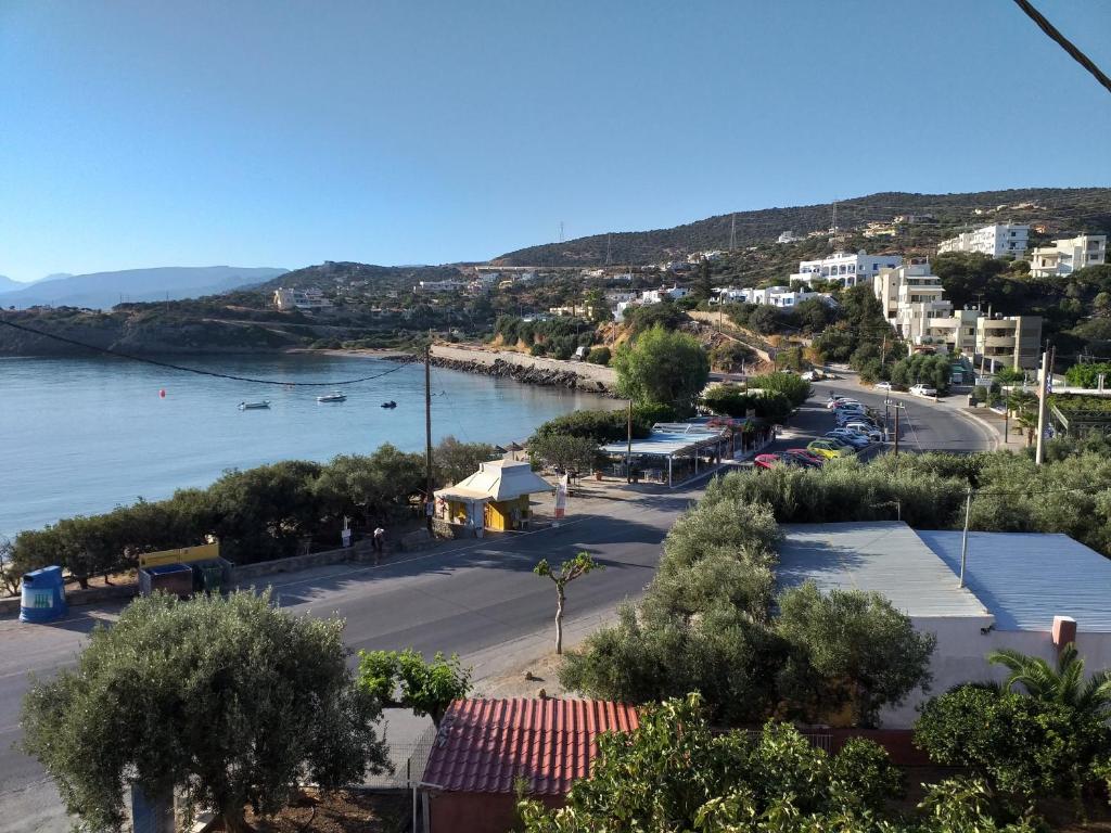 a view of a town and a body of water at Ammos Apartments in Agios Nikolaos