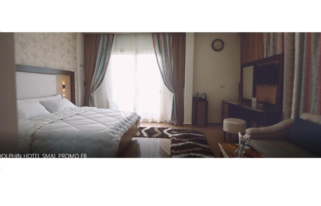 Postel nebo postele na pokoji v ubytování Dolphin Ras El-Bar Hotel