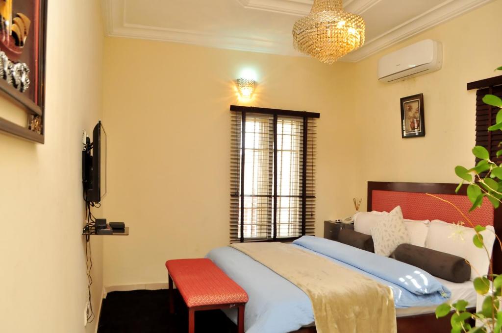Postel nebo postele na pokoji v ubytování J Gibson Hotel