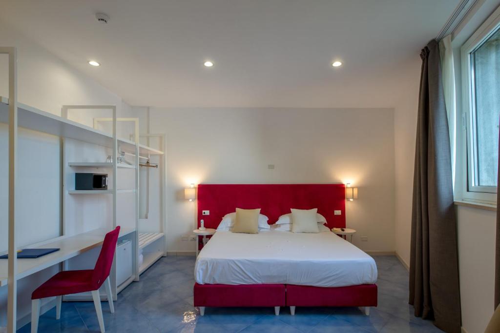 Postel nebo postele na pokoji v ubytování Boutique Hotel Helios