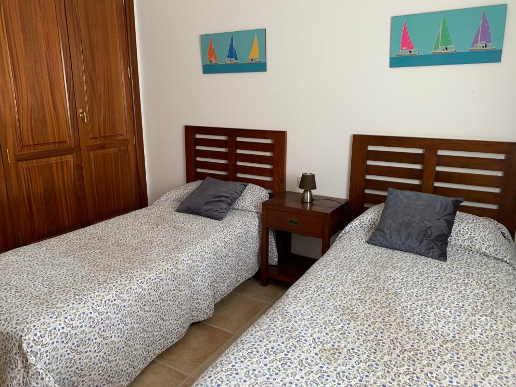 Postel nebo postele na pokoji v ubytování CasadeLanzarote