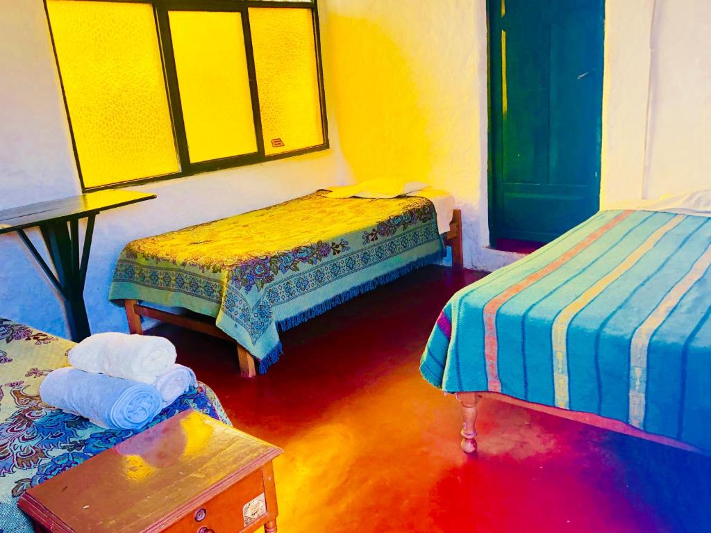 Postel nebo postele na pokoji v ubytování My Friend Surf Hostal