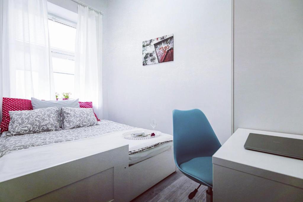 Posteľ alebo postele v izbe v ubytovaní Apartament Niebieski Krakowskie Przedmieście 26