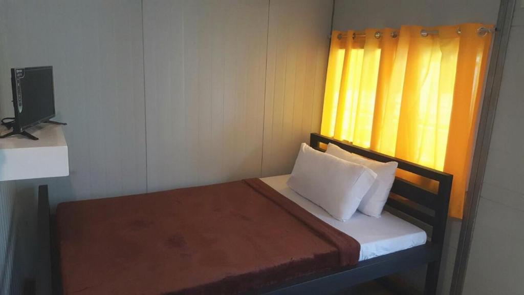 Postel nebo postele na pokoji v ubytování Dormitelsph Cloud 9