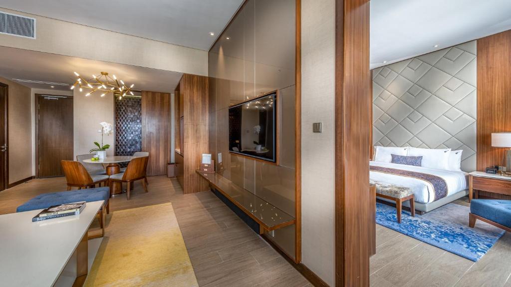 a hotel room with a bed and a table at Hard Rock Hotel Desaru Coast in Desaru