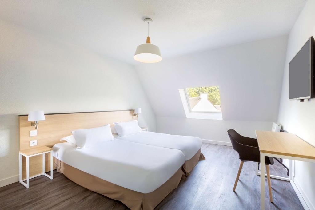 Postel nebo postele na pokoji v ubytování Best Western Armor Park Dinan et Spa