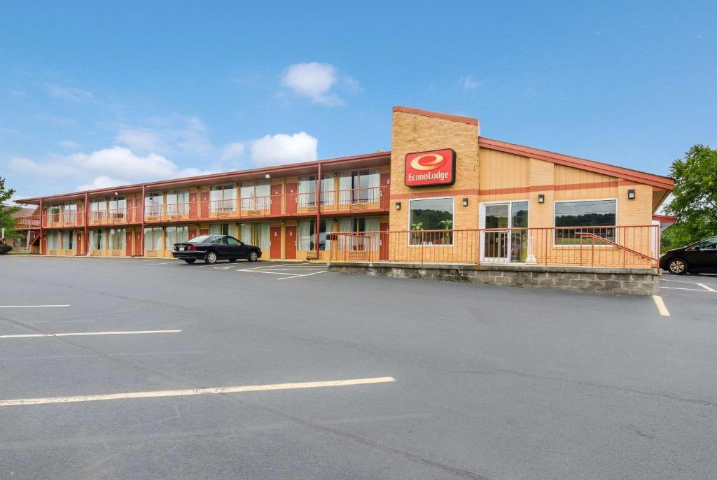 a building with a sign on it in a parking lot at Econo Lodge Marion I-81 in Marion