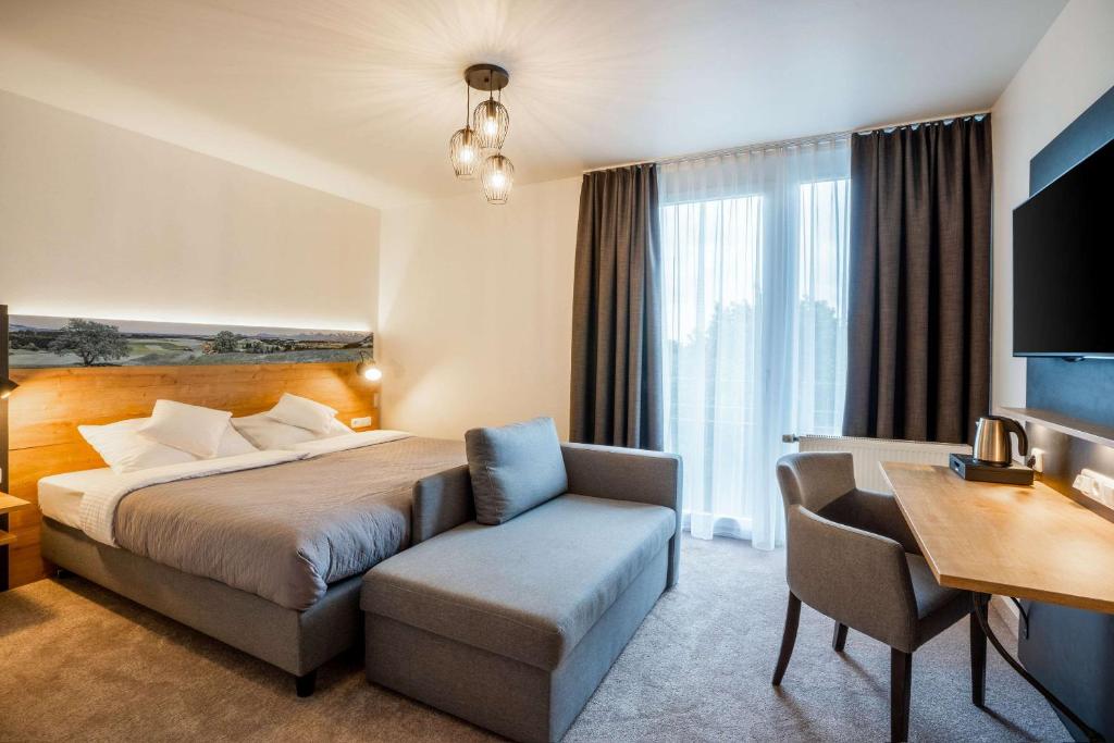 Postel nebo postele na pokoji v ubytování MEAT UND STAY Hotel