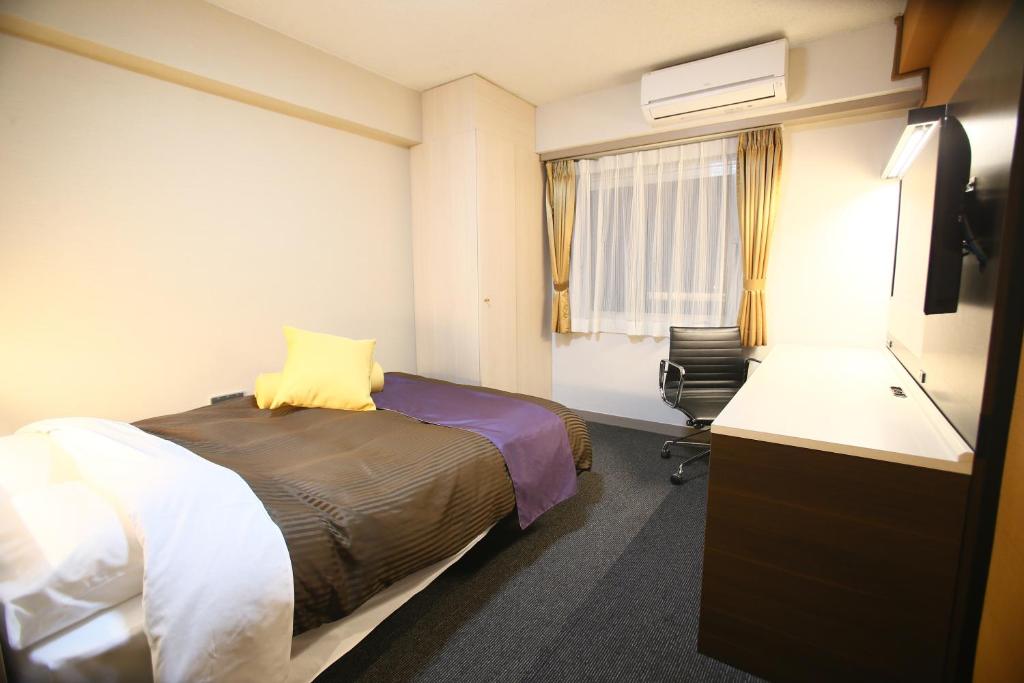 Postel nebo postele na pokoji v ubytování Hotel 1-2-3 Maebashi Mercury