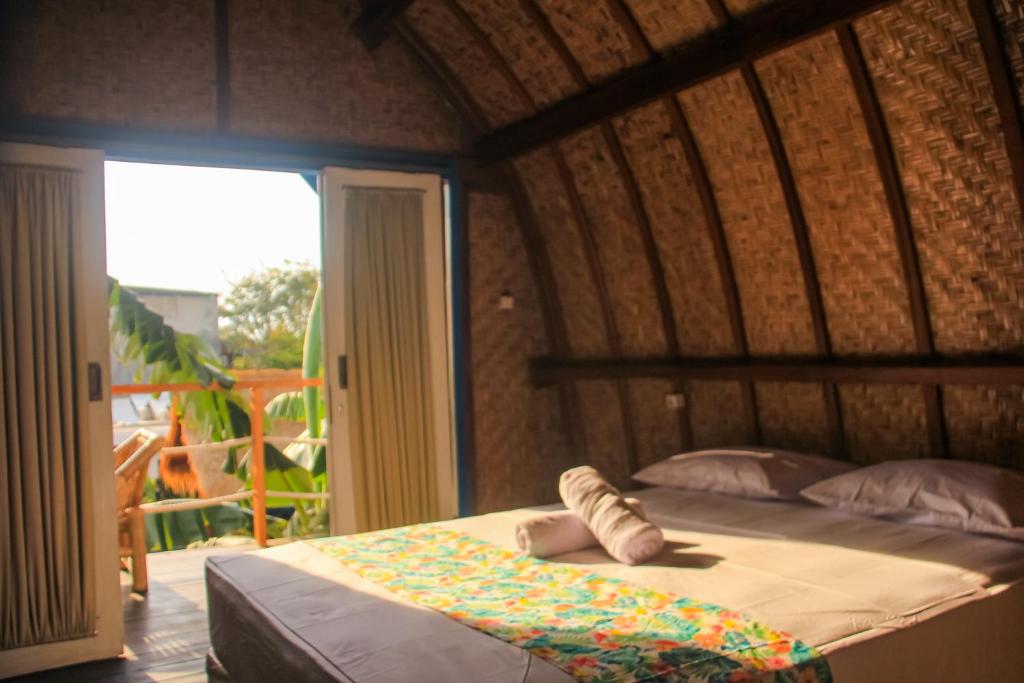 Ένα ή περισσότερα κρεβάτια σε δωμάτιο στο Tropical House Bungalows