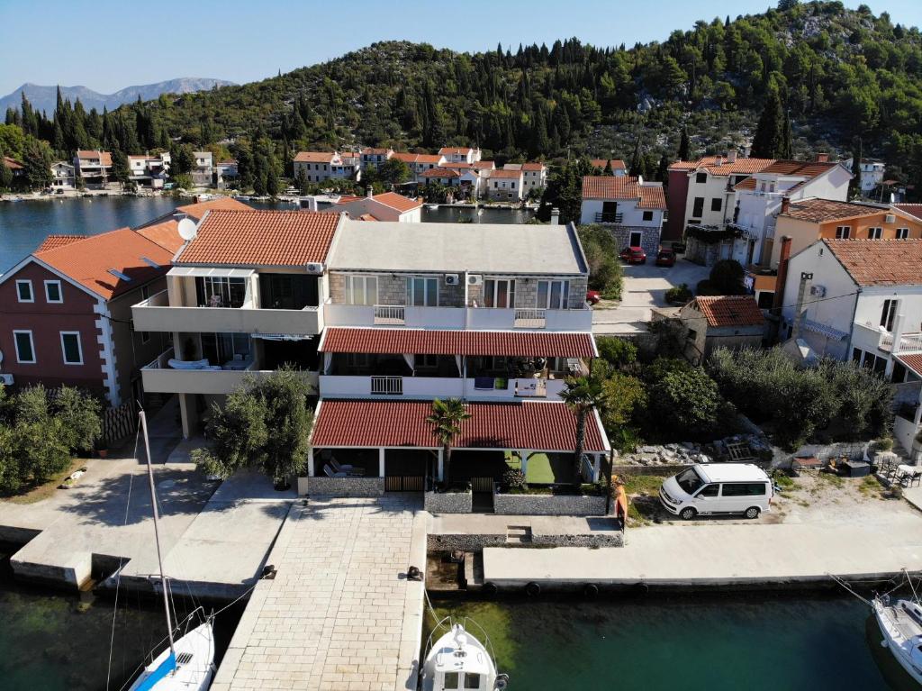 an aerial view of a house with a marina at Marinus Apartments in Blace