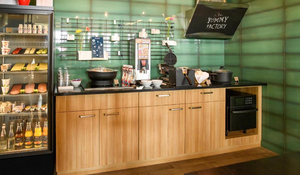 a kitchen with a counter with a counter top at Aparthotel Adagio Muenchen City in Munich