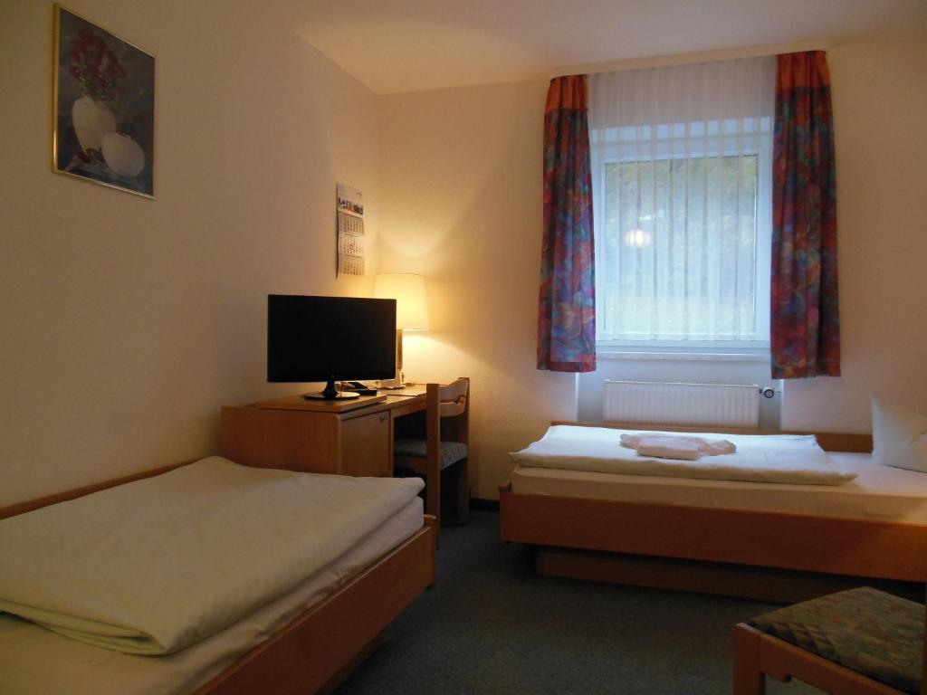 Postel nebo postele na pokoji v ubytování Hotel Asterra