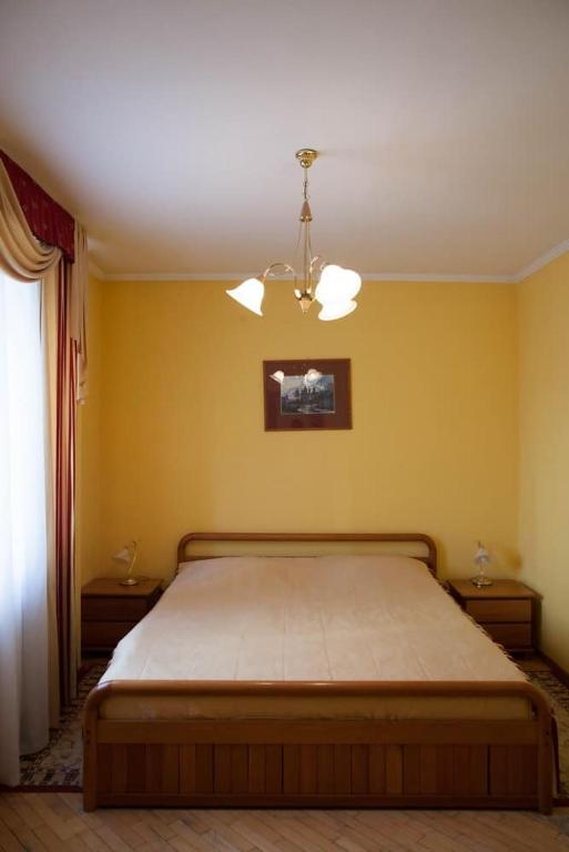 Postel nebo postele na pokoji v ubytování Hotel Obolon