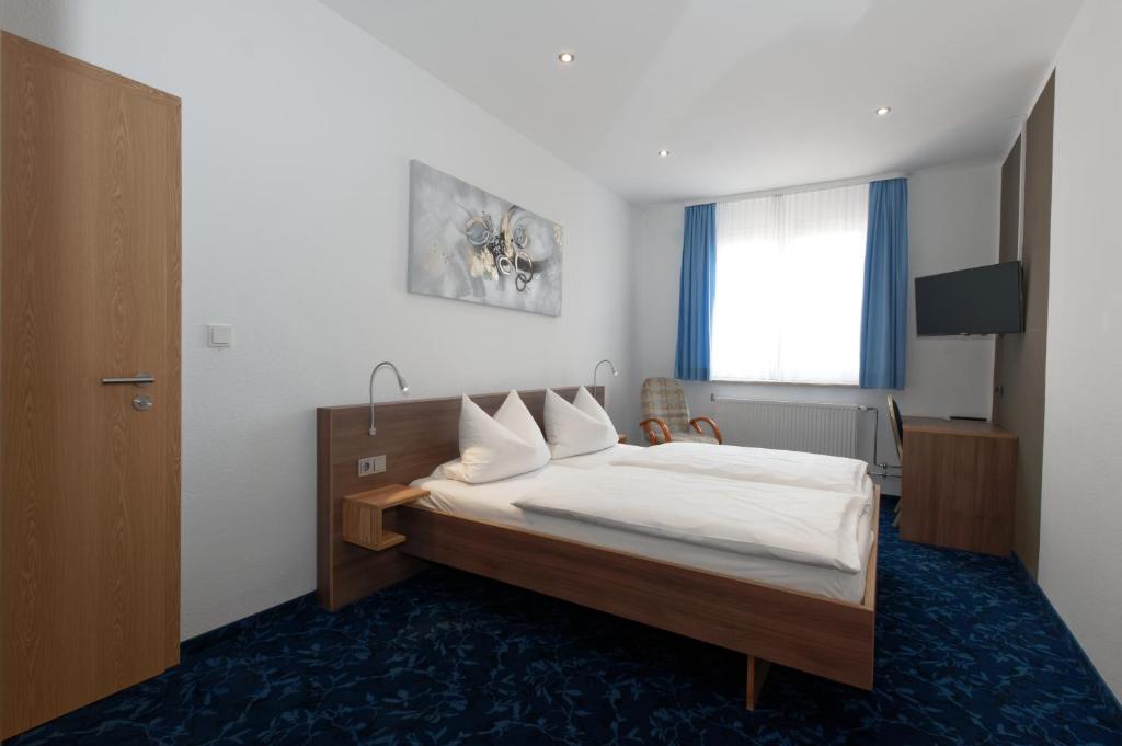 Postel nebo postele na pokoji v ubytování PrivatHotel Probst