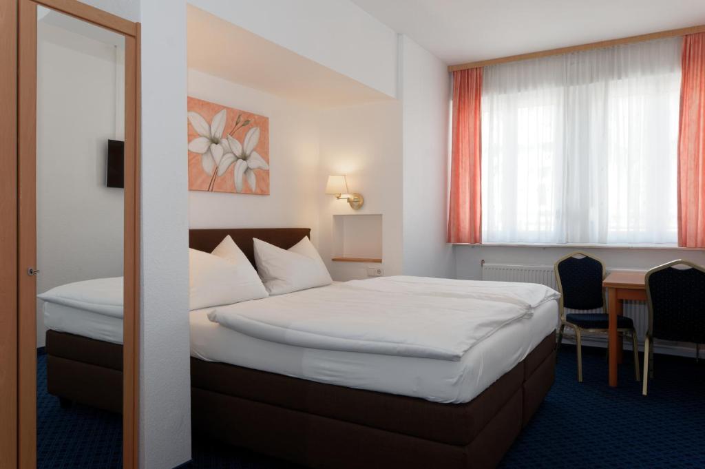 Postel nebo postele na pokoji v ubytování PrivatHotel Probst