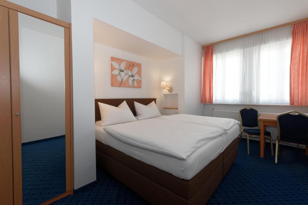 Postel nebo postele na pokoji v ubytování PrivatHotel Probst