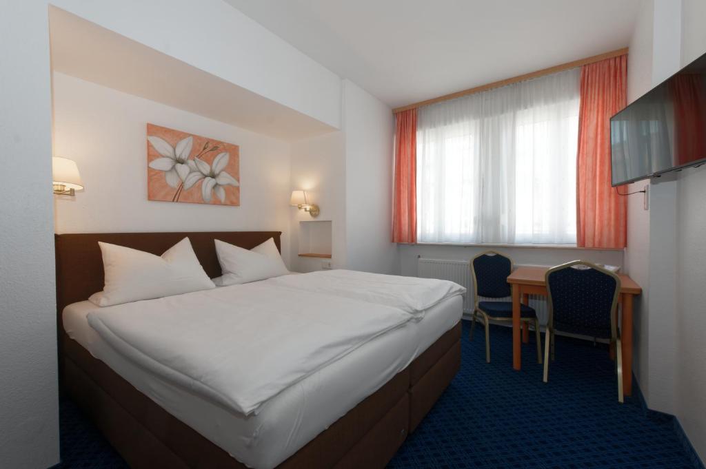 Postel nebo postele na pokoji v ubytování PrivatHotel Probst