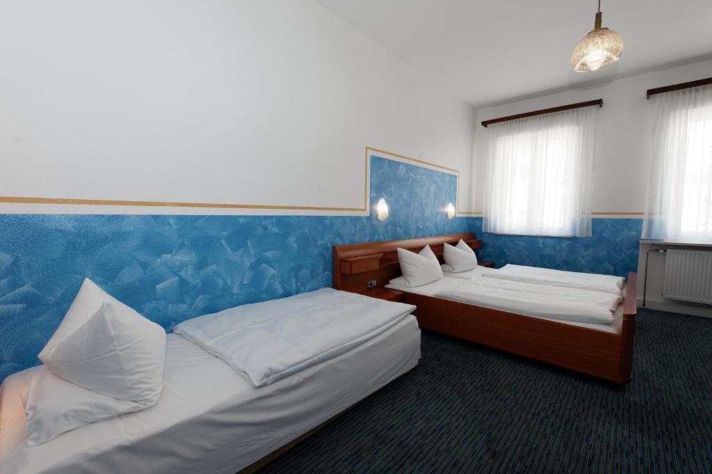 Postel nebo postele na pokoji v ubytování PrivatHotel Probst