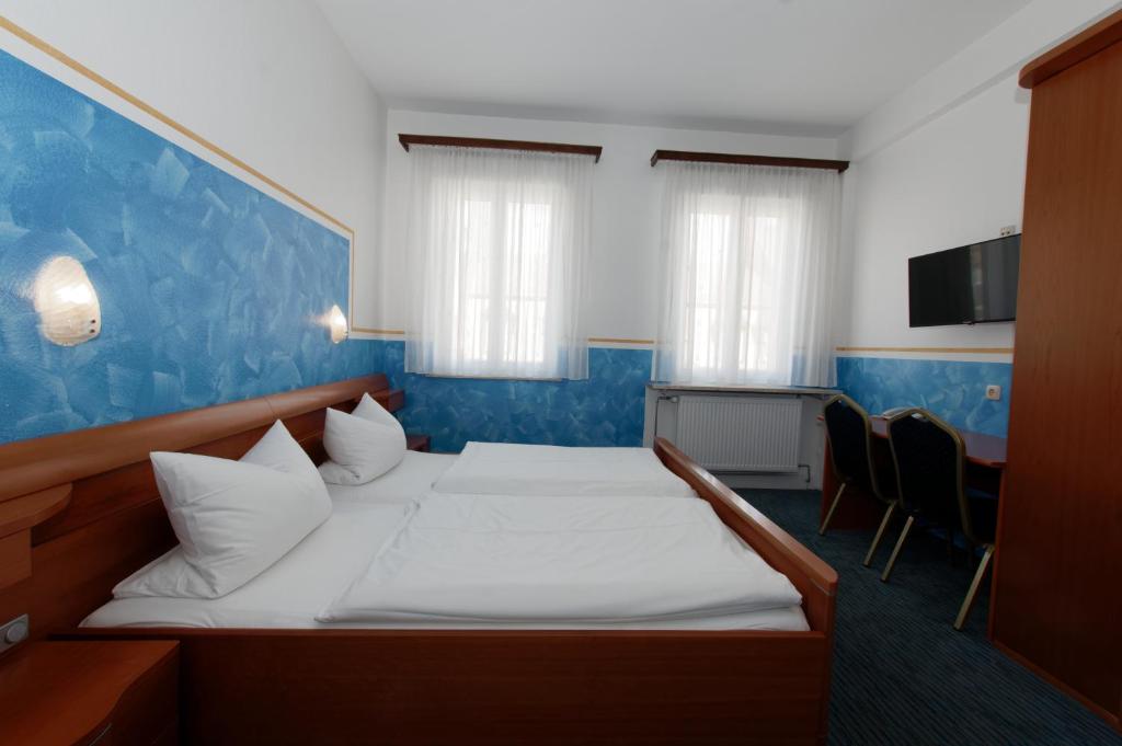 Postel nebo postele na pokoji v ubytování PrivatHotel Probst