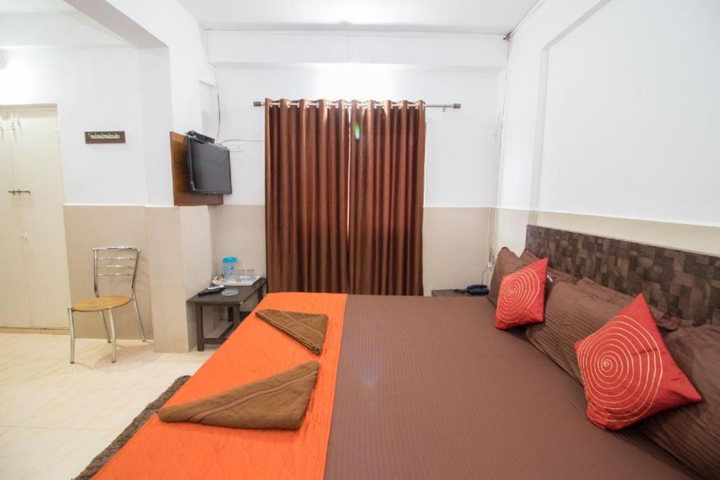 Postel nebo postele na pokoji v ubytování Travo Suites Panjim