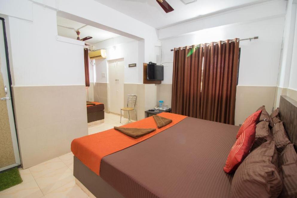 Postel nebo postele na pokoji v ubytování Travo Suites Panjim