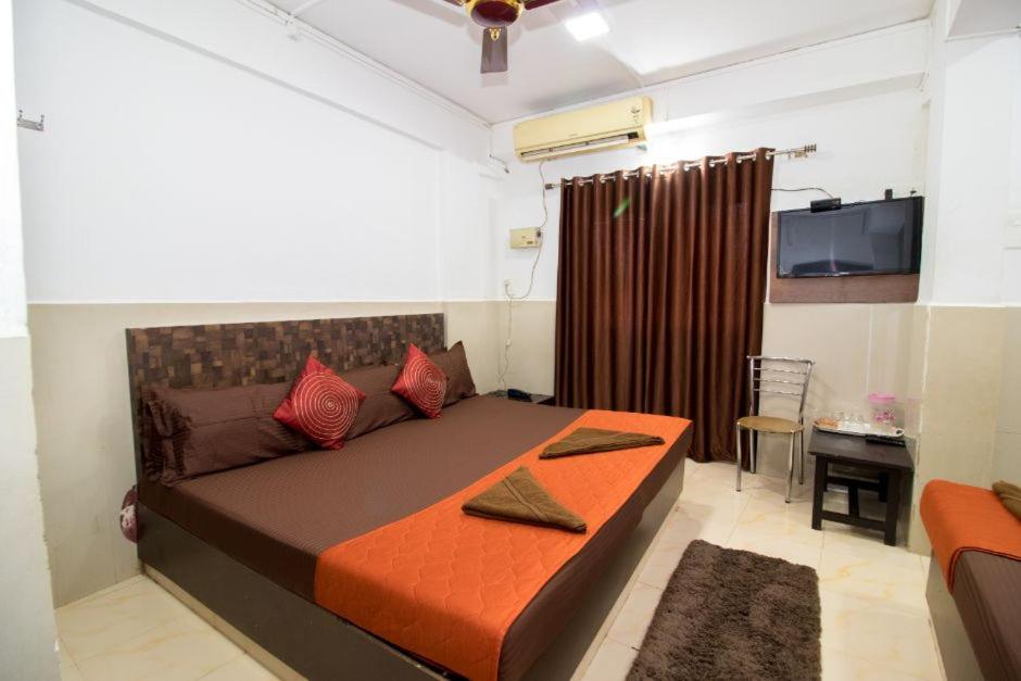 Postel nebo postele na pokoji v ubytování Travo Suites Panjim