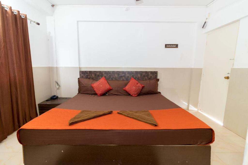 Postel nebo postele na pokoji v ubytování Travo Suites Panjim